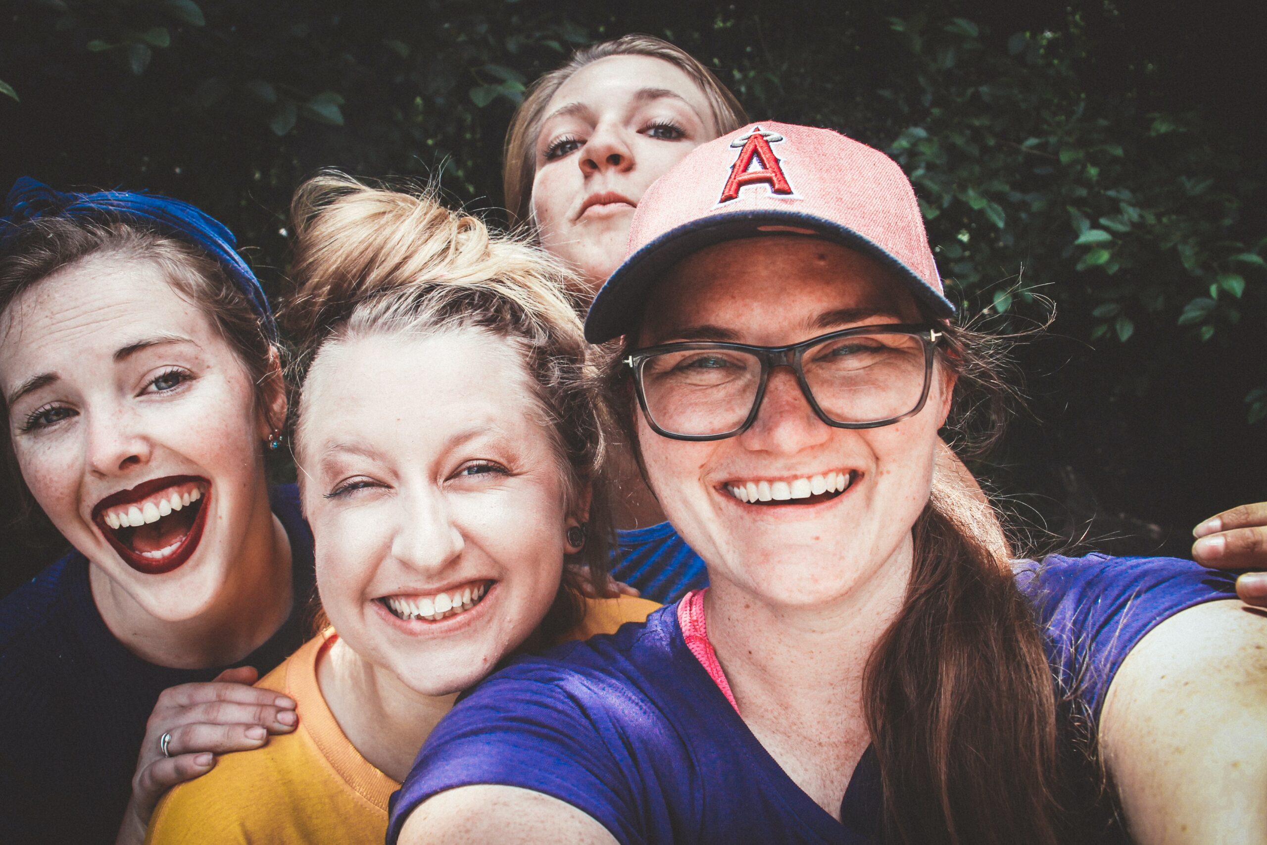 Four young women smiling for a selfie